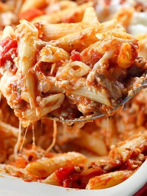 Skinny Cheesy Pasta Bake is a delicious layered casserole made lighter by using ground turkey and whole wheat pasta!