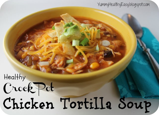 Healthy Chicken Tortilla Soup cooked right in the crock pot for an easy and delicious dinner! Tender chicken, beans and corn in a flavorful broth served with homemade crispy tortilla strips. Yum!