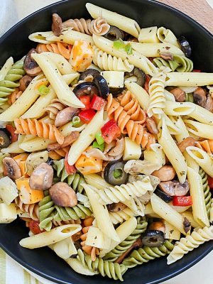 This unbelievable Best Ever Pasta Salad will be the hit of the picnic! Full of pasta, cheese cubes, pepperoni, olives and veggies and topped with a homemade dressing - this will be an instant favorite!