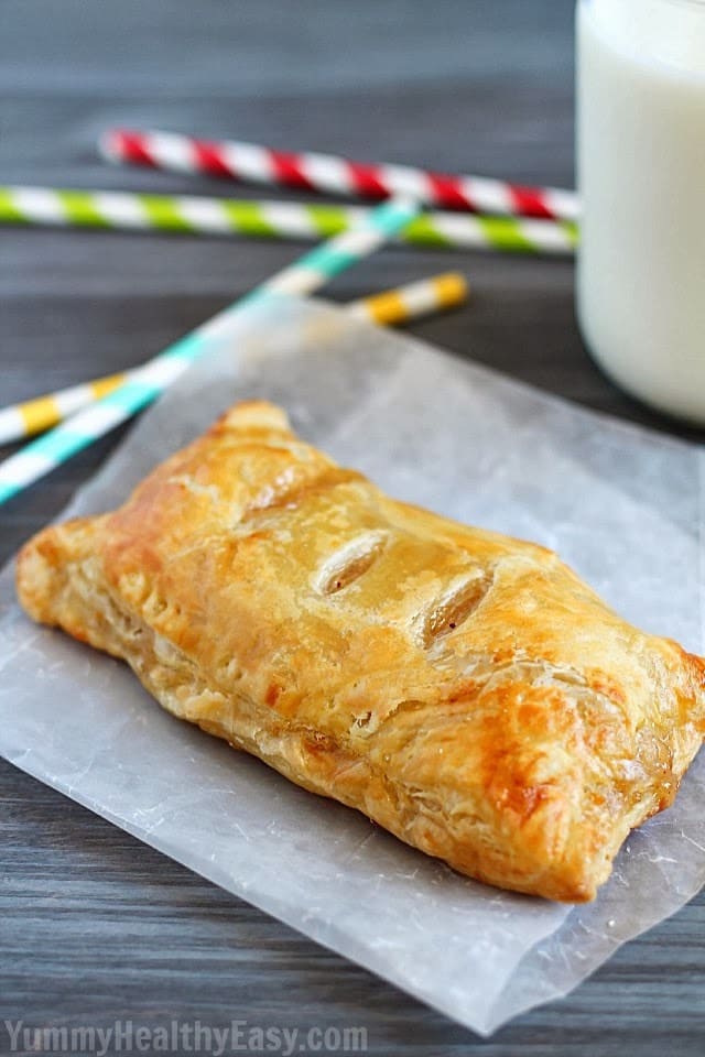 Easy Apple Hand Pies | flaky puff pastry squares filled with homemade (easy) apple pie filling. They're a simpler alternative to apple pie that you can hold in your hand! Apple Hand Pies