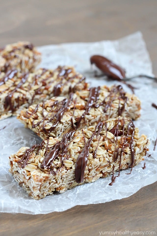 Easy No-Bake Granola Bars - simple granola bars with oats, almonds and coconut with a delicious chocolate & nutella drizzle on top. Easy No-Bake Granola Bars - simple granola bars with oats, almonds and coconut with a delicious chocolate & nutella drizzle on top.