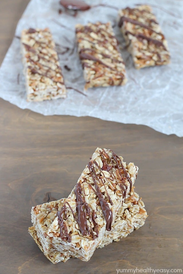 Easy No-Bake Granola Bars - simple granola bars with oats, almonds and coconut with a delicious chocolate & nutella drizzle on top. Easy No-Bake Granola Bars - simple granola bars with oats, almonds and coconut with a delicious chocolate & nutella drizzle on top.