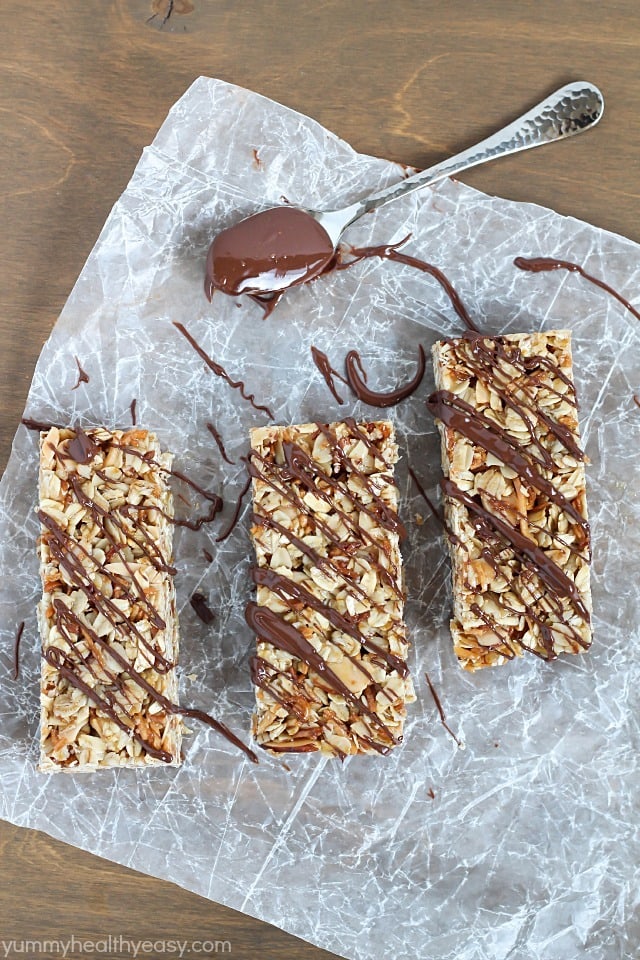 Easy No-Bake Granola Bars - simple granola bars with oats, almonds and coconut with a delicious chocolate & nutella drizzle on top. Easy No-Bake Granola Bars - simple granola bars with oats, almonds and coconut with a delicious chocolate & nutella drizzle on top.