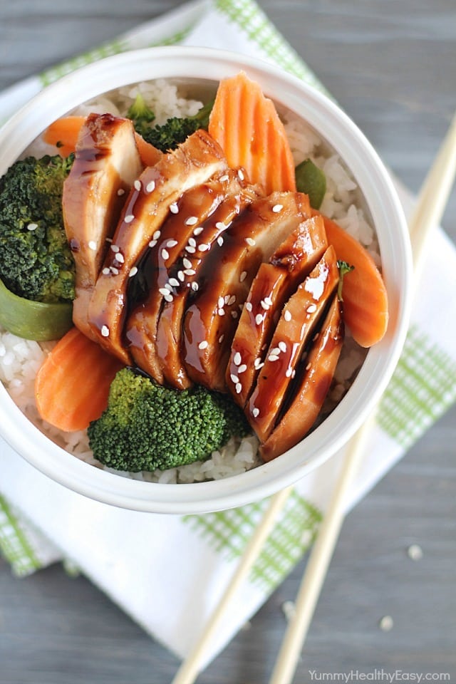 Delicious Chicken Teriyaki Bowls with chicken baked in a homemade teriyaki sauce layered on top of a bed of rice & veggies!