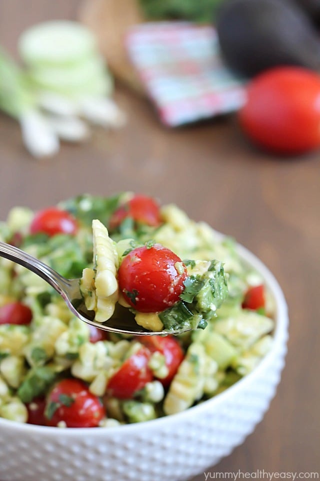 Delicious grilled corn mixed together with avocado, tomato, feta, green onions, cilantro and cucumber then tossed in an easy dressing. The perfect refreshing side dish for a BBQ!