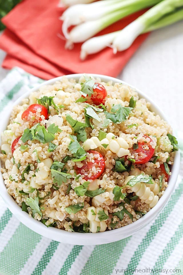 Quinoa Salad full of healthy quinoa, grilled corn, cherry tomatoes, cilantro and spices. Delicious!