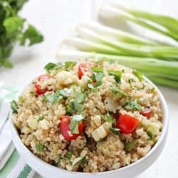 Quinoa Salad full of healthy quinoa, grilled corn, cherry tomatoes, cilantro and spices. Delicious!