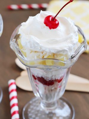 Tropical Trifle - layers of angel food cake, strawberries, pineapple, coconut, cream of coconut & topped with whipped cream! So tasty!