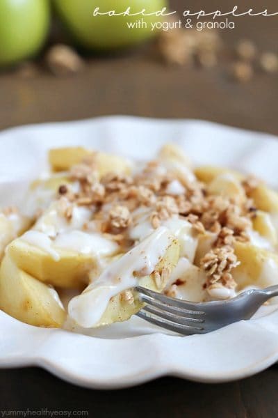 Baked Apples tossed in maple syrup and served with spiced yogurt and granola. Easy and healthy dessert, snack or breakfast!