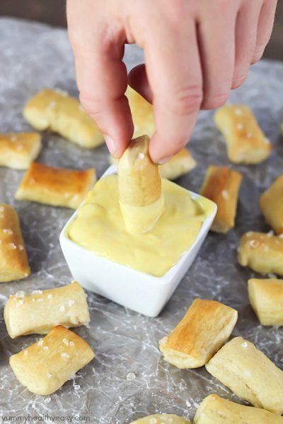 Pretzel Bites dunked in an EASY honey mustard dipping sauce...perfect for noshing after school or while watching a football game!