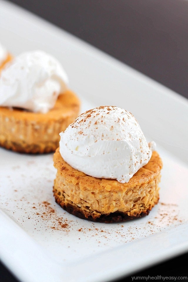 Perfect single-size Mini Pumpkin Cheesecakes full of soft, creamy, pumpkin yumminess and less than 160 calories per cheesecake! Best fall dessert yet!