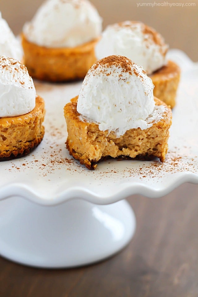 Perfect single-size Mini Pumpkin Cheesecakes full of soft, creamy, pumpkin yumminess and less than 160 calories per cheesecake! Best fall dessert yet!
