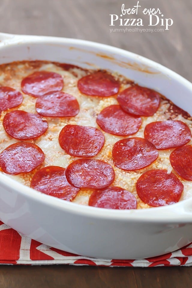 The most unbelievable pizza dip! A layer of herbed cream cheese, homemade sauce, cheese and then topped with pepperoni. AMAZING!