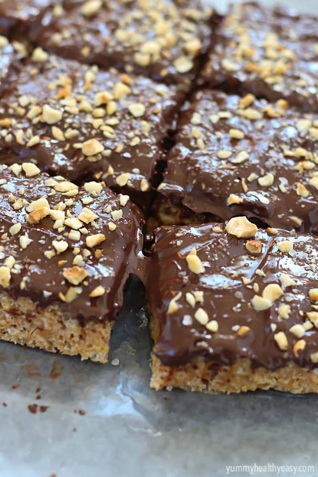 A layer of peanut butter Rice Kripsie treats topped with a layer of dark chocolate, hazelnuts and a little bit of sea salt. These scotcheroos will knock your socks off!