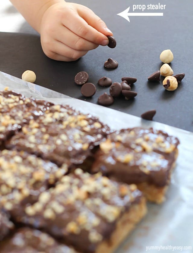A layer of peanut butter Rice Kripsie treats topped with a layer of dark chocolate, hazelnuts and a little bit of sea salt. These scotcheroos will knock your socks off!
