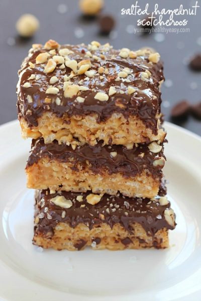 A layer of peanut butter Rice Kripsie treats topped with a layer of dark chocolate, hazelnuts and a little bit of sea salt. These scotcheroos will knock your socks off!