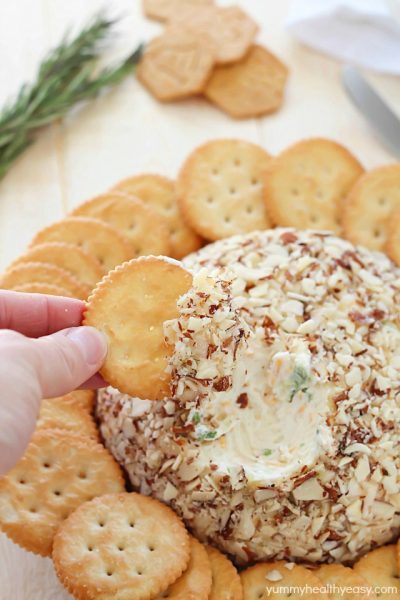 A super easy cheese ball that's sure to impress any guests! It's creamy, tangy, irresistible and won't take more than a few minutes to whip up.