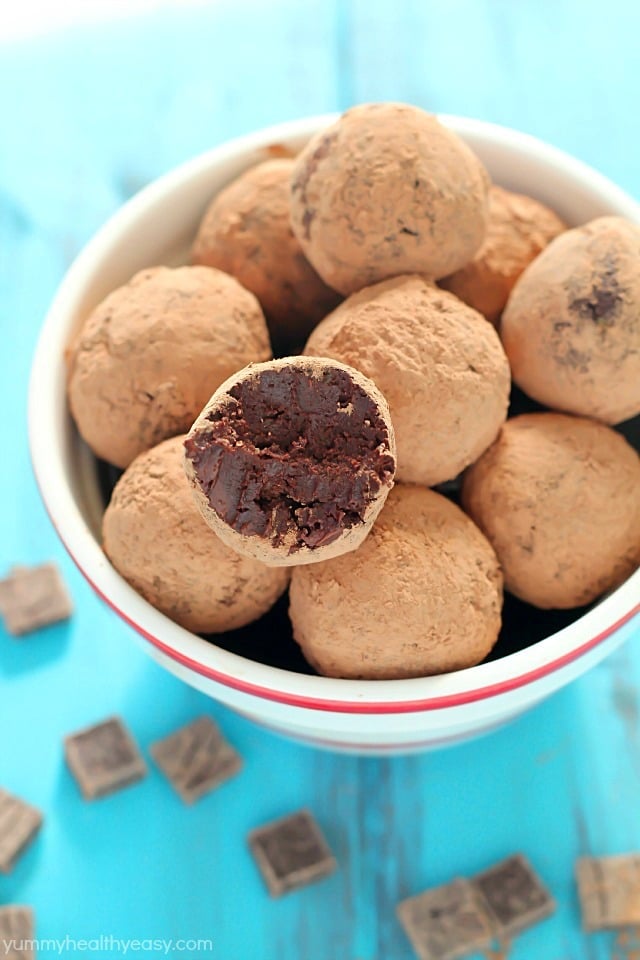 An unbelievably smooth, creamy and decadent truffle chocolates recipe made with...wait for it... AVOCADO! Only 94 calories per truffle! These are so ridiculously good and a must-make healthy treat for Valentine's Day!