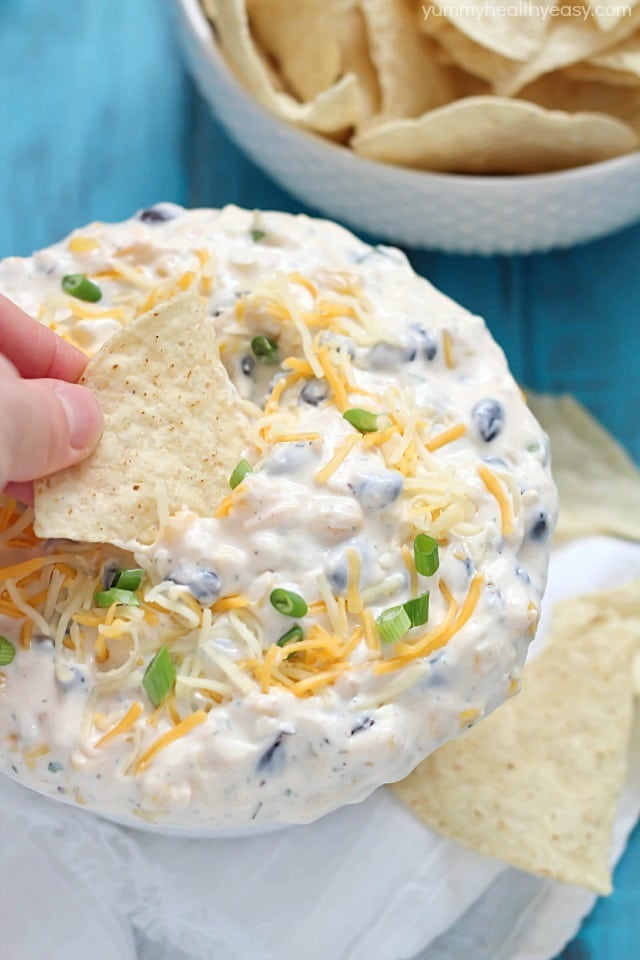 Quick Southwest Dip that's perfect for whipping up when entertaining guests or to devour when watching your favorite TV show. Creamy ranch & southwestern flavors, corn, black beans and cheese - so delicious! #cadairy