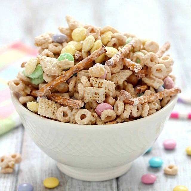 Super delicious and easy Bunny Bait aka Easter Snack Mix. Made with cereal, pretzels, peanuts, pastel M&M candies and white chocolate - perfect for Easter!