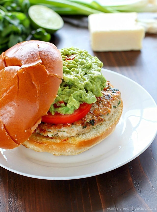 The juiciest, most delicious, guacamole chicken burgers! Super simple to make - serve on buns with a layer of guacamole on the top. Amazing!