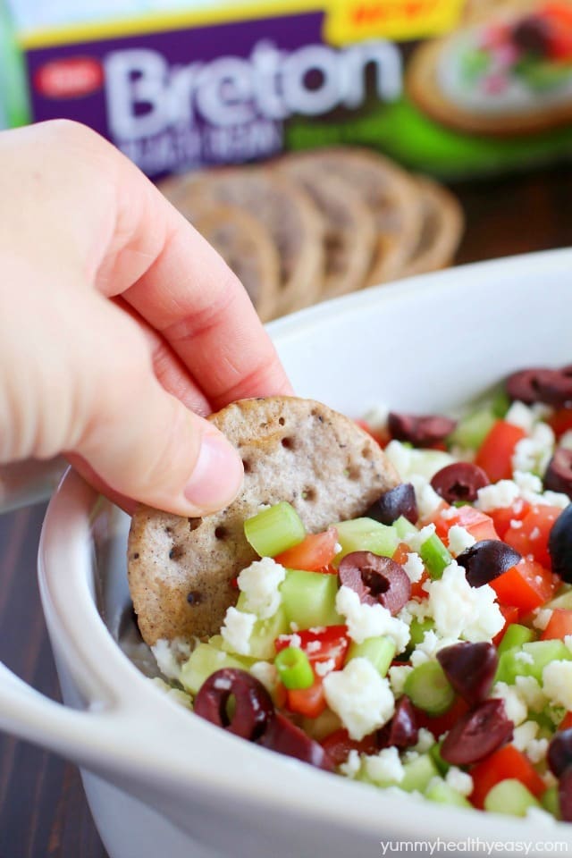 Deliciously healthy greek dip, made with a protein-rich cottage cheese base (with ranch seasonings!) then topped with cucumbers, green onions, tomatoes, kalamata olives, and feta cheese. Healthy and full of flavor! #breton #ad