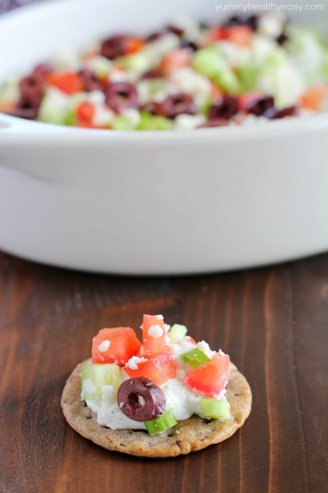 Deliciously healthy greek dip, made with a protein-rich cottage cheese base (with ranch seasonings!) then topped with cucumbers, green onions, tomatoes, kalamata olives, and feta cheese. Healthy and full of flavor! #breton #ad