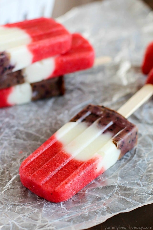 Red, White & Blueberry Healthy Fruit Popsicles - a healthy and easy treat the entire family will gobble up! Perfect to make for Memorial Day or 4th of July... or really anytime. :)