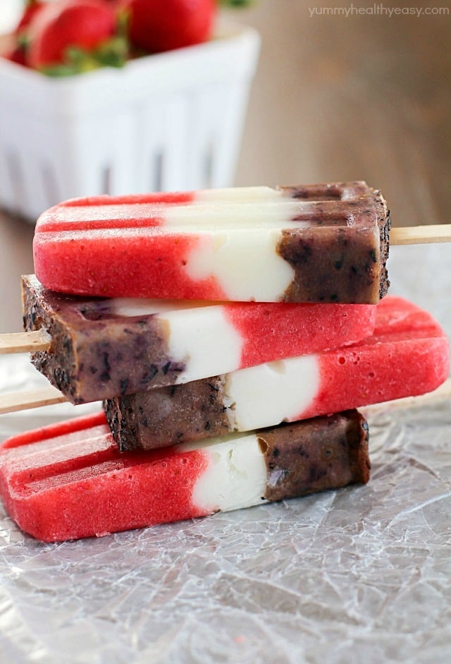 Red, White & Blueberry Healthy Fruit Popsicles - a healthy and easy treat the entire family will gobble up! Perfect to make for Memorial Day or 4th of July... or really anytime. :)