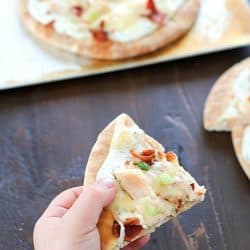 Bacon Ranch Chicken Pita Pizza is topped with ranch dip, chicken, bacon and cheese for a quick and easy lunch, dinner or snack. They have tons of flavor with only a few ingredients and take 30 minutes or less to make! #sponsored #ad