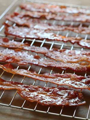 Brown Sugar Bacon aka Candied Bacon aka the Best Bacon EVER! This easy bacon is baked in the oven with a topping of brown sugar and pepper, and comes out sticky, sweet & savory. Absolutely drool-worthy!