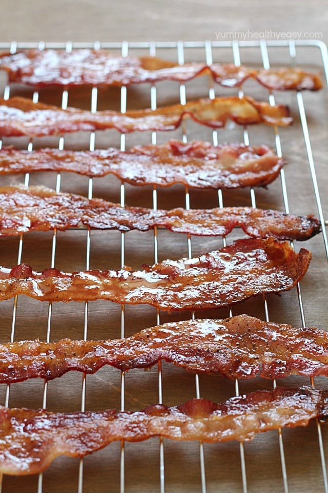 Brown Sugar Bacon aka Candied Bacon aka the Best Bacon EVER! This easy bacon is baked in the oven with a topping of brown sugar and pepper, and comes out sticky, sweet & savory. Absolutely drool-worthy!