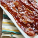 Brown Sugar Bacon aka Candied Bacon aka the Best Bacon EVER! This easy bacon is baked in the oven with a topping of brown sugar and pepper, and comes out sticky, sweet & savory. Absolutely drool-worthy!