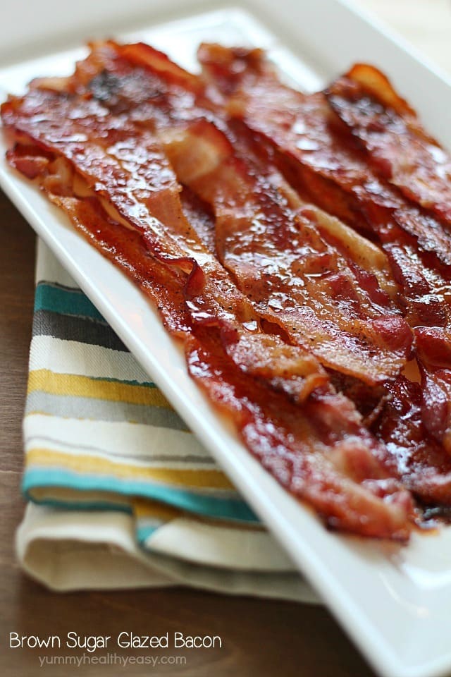 Brown Sugar Bacon aka Candied Bacon aka the Best Bacon EVER! This easy bacon is baked in the oven with a topping of brown sugar and pepper, and comes out sticky, sweet & savory. Absolutely drool-worthy!