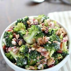 Need an easy side dish? Make this Creamy Broccoli Salad! It's full of fresh broccoli, red onion, dried cranberries, sunflower seeds and bacon mixed in a creamy, delicious dressing. Always a hit!