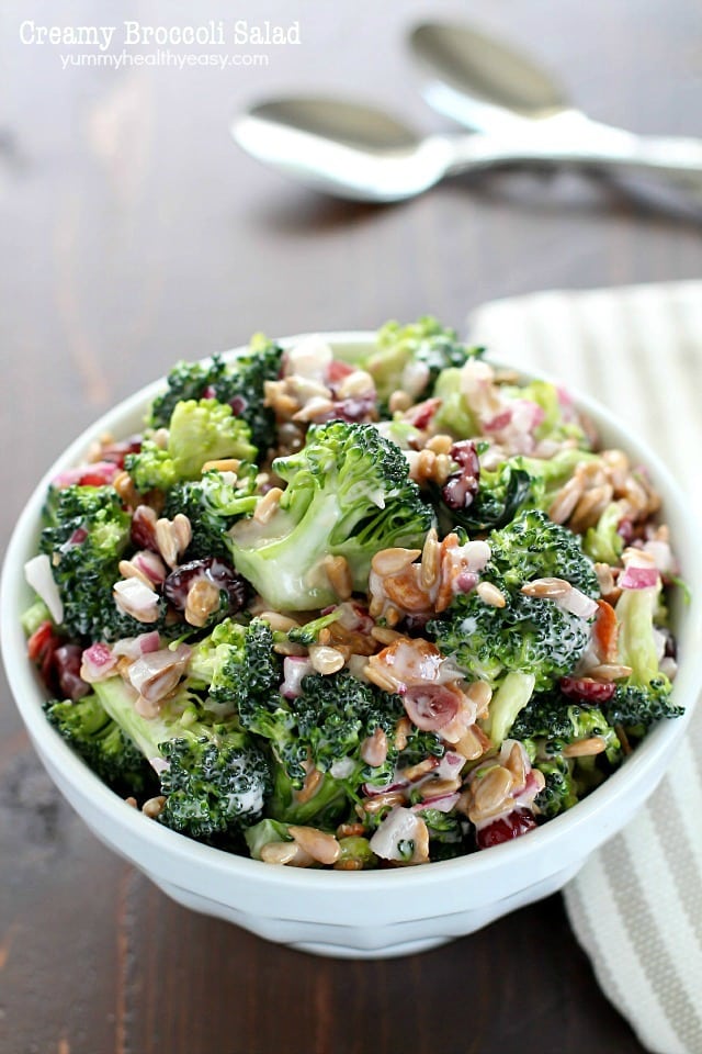 Need an easy side dish? Make this Creamy Broccoli Salad! It's full of fresh broccoli, red onion, dried cranberries, sunflower seeds and bacon mixed in a creamy, delicious dressing. Always a hit!