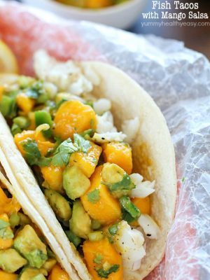 You will love these Fish Tacos with Mango Salsa! Corn tortillas filled with flaky white fish and topped with fresh mango and avocado salsa. Doesn't get better than that! #ad