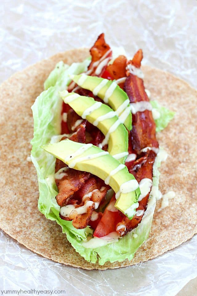 Sick of boring lunches? You NEED to throw an easy BLTA wrap in the lunchbox! What could be better than a bacon, lettuce, tomato & avocado wrap with a creamy dressing? Seriously the most amazing wrap ever. #Tessemaes #BacktoSchool #ad
