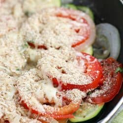 No better way to use up that summer zucchini than in a healthy and easy side dish! This Tomato Zucchini Skillet is made in one pan and kicks the pants off those frozen veggie side dishes!