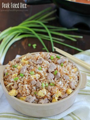 Crazy delicious kid-friendly, family-favorite Pork Fried Rice that's easy, only has seven simple ingredients, takes 20 minutes or less and will WOW any and everyone! Definitely PIN this for later!