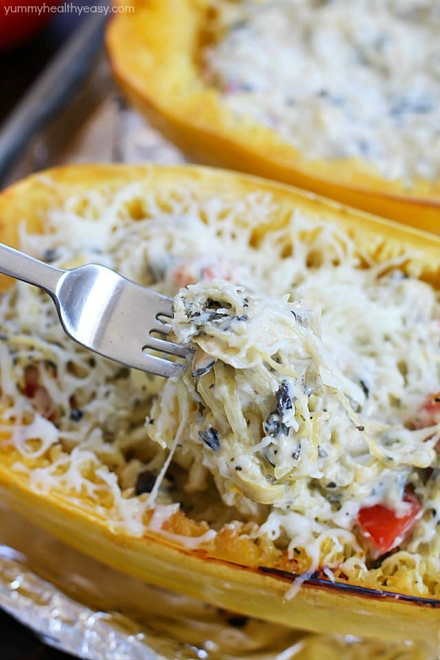 This recipe for Spinach & Artichoke Stuffed Spaghetti Squash is super easy and is a fabulous, flavorful, healthy meatless main or side dish. A healthy dish you can feel good about eating! #ad
