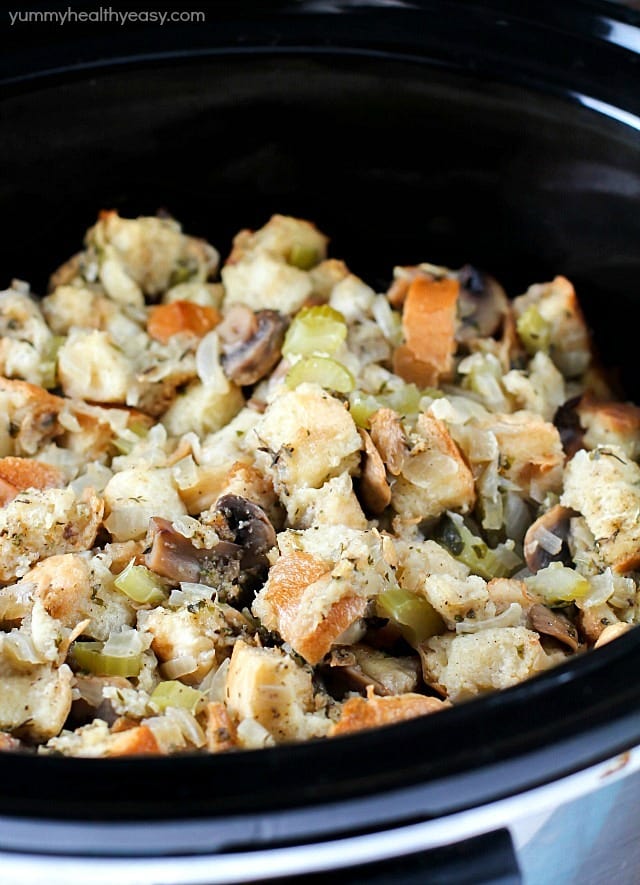 So many great spices & flavors going on in this Crock Pot Stuffing Recipe! It beats the pants off of those other blah stuffing recipes. Plus it's cooked in the slow cooker, so you can put it in hours before dinnertime and not even think about it until you eat! Perfect for Thanksgiving or any other day of the year!