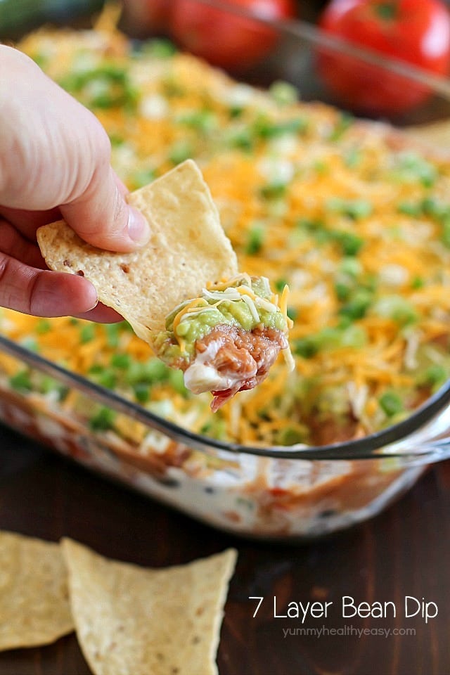 You will love this 7 Layer Bean Dip! This is the quick & easy recipe my Mom always uses for the most requested, most popular appetizer in our family. It's perfect to bring to a party or to serve during game day!