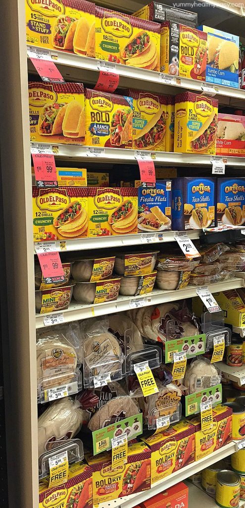 Ground Turkey Tacos that are oven-baked with layers of deliciousness inside! Refried beans, ground turkey taco meat, (no taco seasoning mix!) tomato, cilantro, green onions and cheese all baked in taco shells. Perfect for Taco Tuesday or for game day! AD