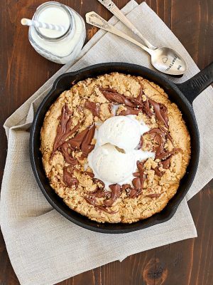 How about a Skillet Cookie with a Nutella Swirl for dessert? Yes! A warm, lightened-up cookie with a Nutella swirl & a scoop of low-fat ice cream on top + a spoon! Just like a "pizookie" at your favorite restaurant! PLUS 23 more amazing Nutella recipes that will have your mouth watering!