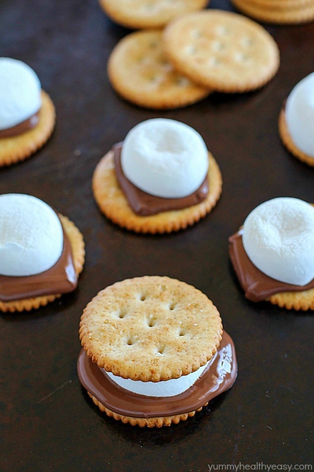 Oven S'mores Sandwiches for the WIN! You don't need a campfire to enjoy s'mores, make them in the oven instead! These oven smores are incredibly easy to make (about 5 minutes total!) and are the perfect combo of salty and sweet. So delicious! AD