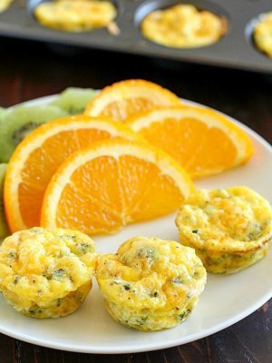 Egg Breakfast Muffins that are full of kale, potato, egg and topped with cheese. Mini, kid-friendly, easy to make, and quick to reheat for a breakfast on the go! AD