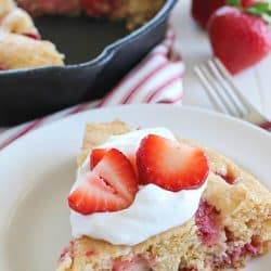 This Strawberry Skillet Corn Cake is full of strawberry goodness! It's super easy to make, with only a few ingredients and absolutely perfect to serve for brunch, dessert or a fun snack!