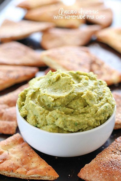 Avocado Hummus with Homemade Pita Chips - you will go crazy for the combo of avocado, garbanzo beans and spices! Dip in some easy homemade pita chips, and you have yourself a healthy, flavorful snack!
