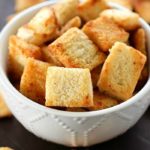Garlic Parmesan Homemade Croutons are easy to make and cheaper than the store-bought kind! Tons of garlic parmesan flavor make these homemade croutons out of this world!!